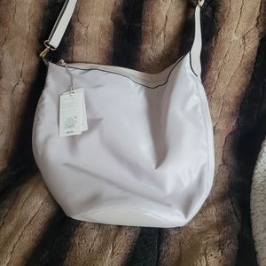 a . new day shoulder bag/sling backpack
